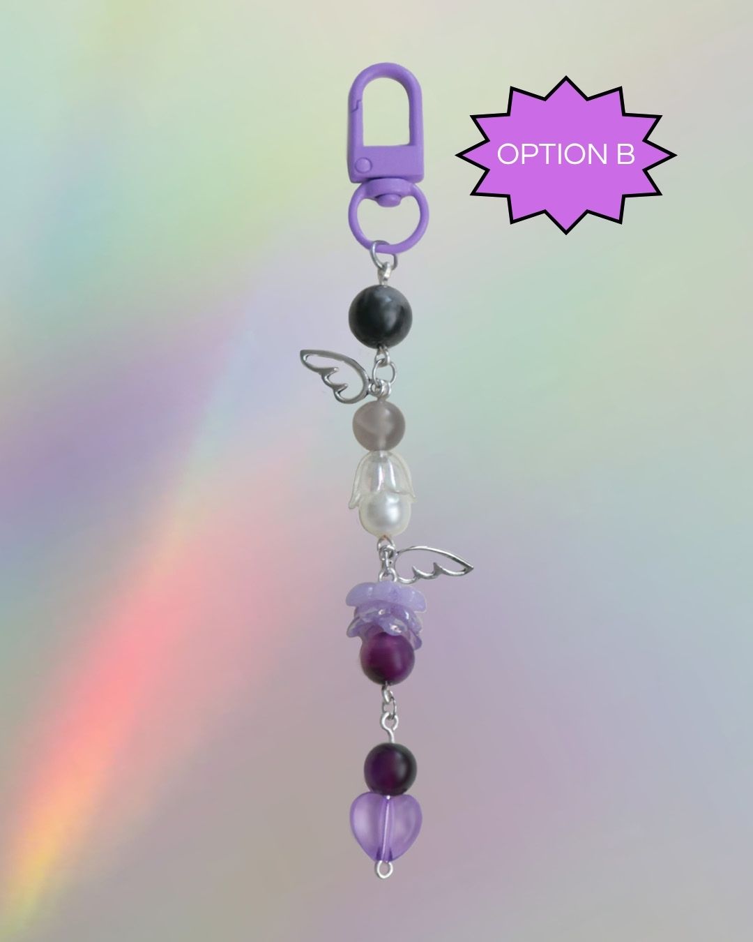 Ace flag themed keychain with purple, black, grey, and clear beads 