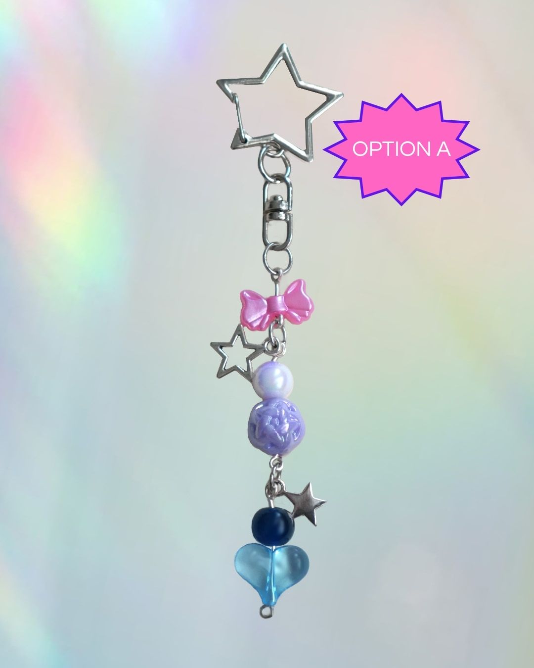 Bi flag themed keychains with purple, blue, and pink beads and a silver clasp