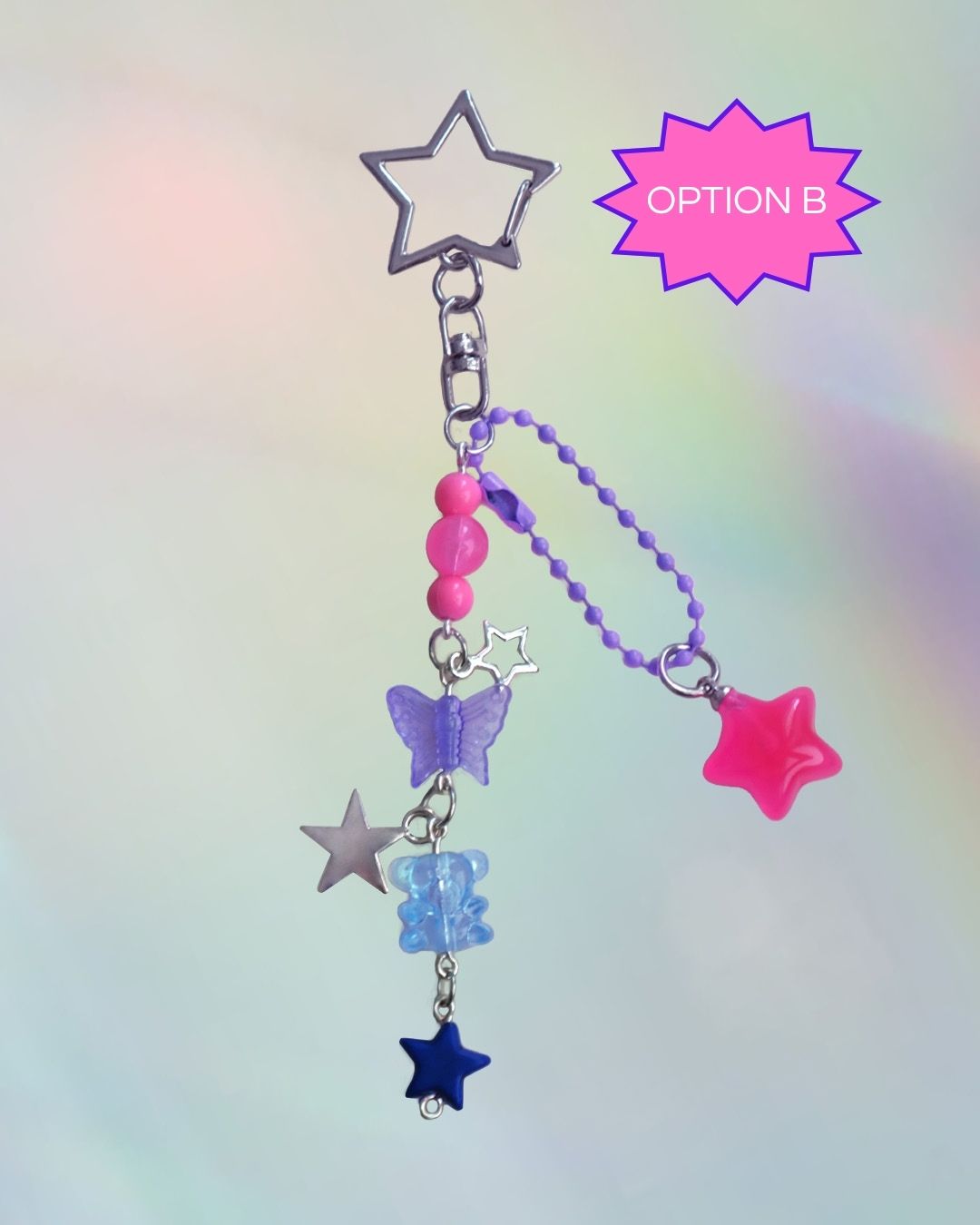 Bi flag themed keychains with purple, blue, and pink beads and a silver clasp
