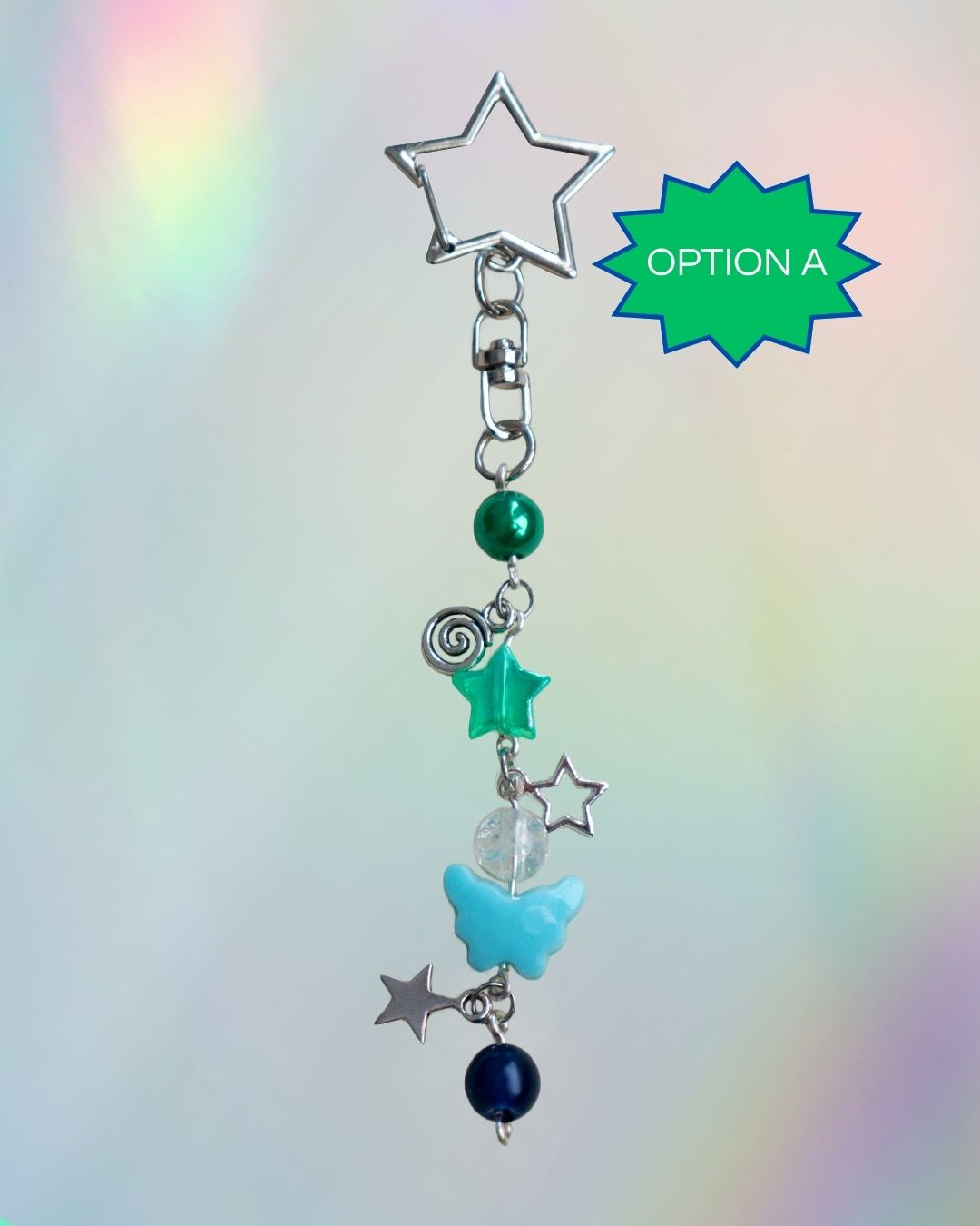 Gay flag themed keychain with green and blue beads and a silver clasp