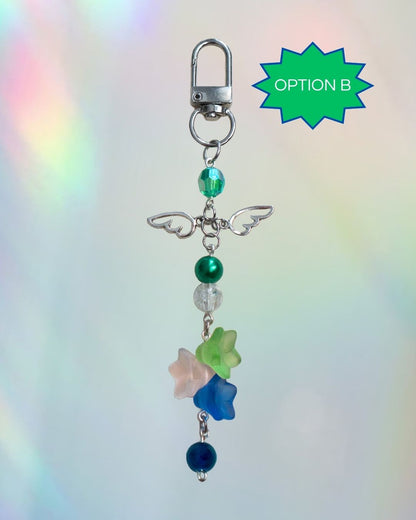 Gay flag themed keychain with green and blue beads and a silver clasp