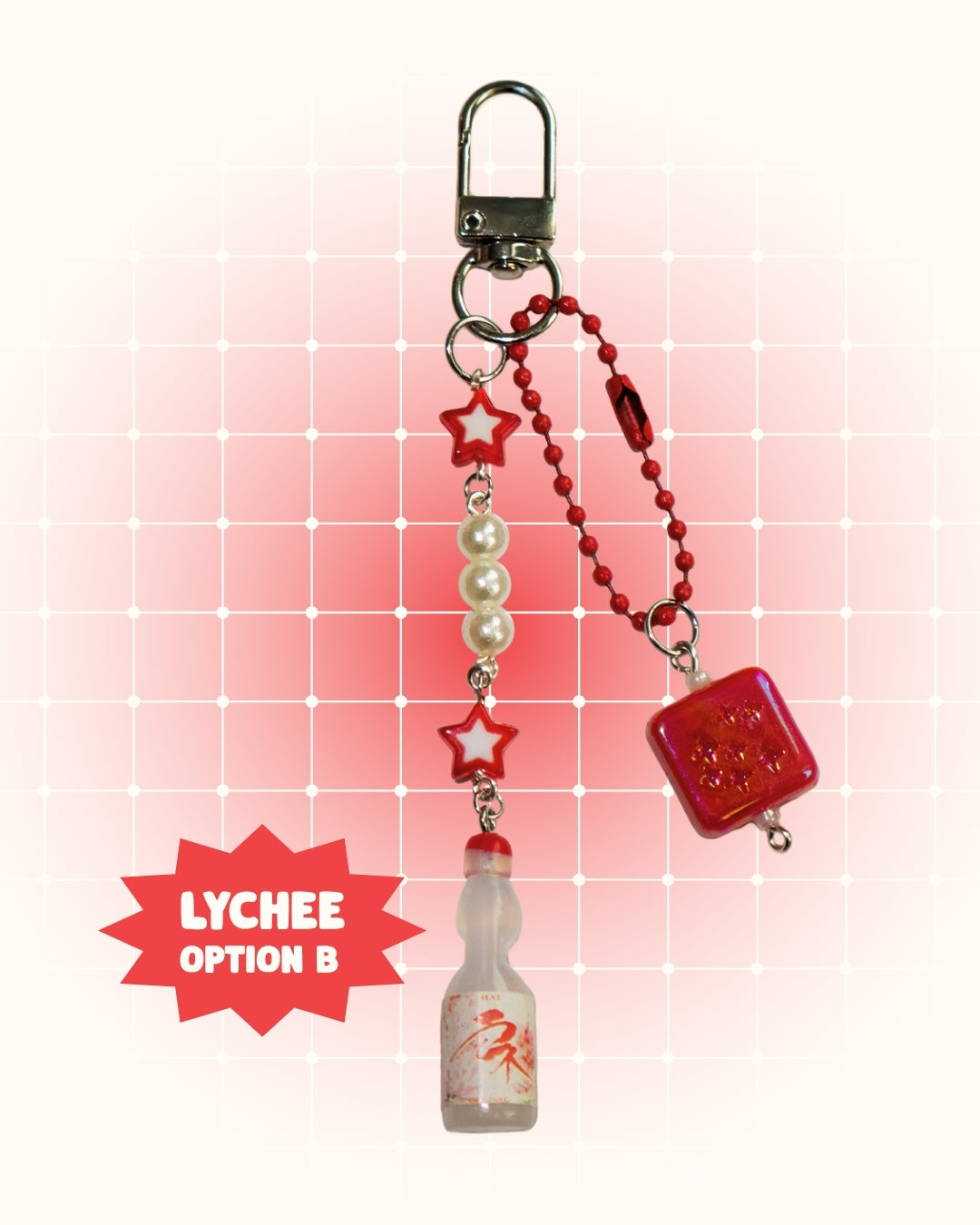 Keychain with red dice charm and Lychee flavored soda on a red grid background