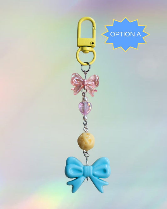 Pan flag themed keychain with pink, blue, and yellow beads and a yellow clasp