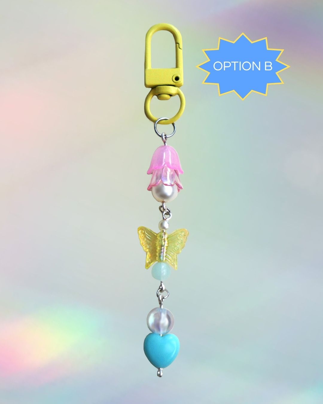 Pan flag themed keychain with pink, blue, and yellow beads and a yellow clasp