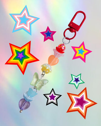 Colorful keychain with rainbow colored beads on an iridescent gradient background
