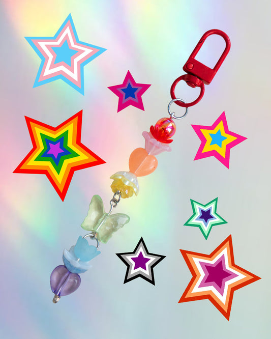 Colorful keychain with rainbow colored beads on an iridescent gradient background
