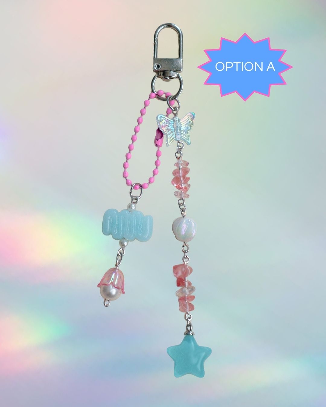 Trans flag themed keychain with blue, pink, and white beads and silver clasp